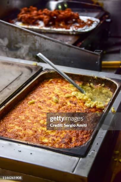 mac & cheese in a serving container - mac and cheese stock pictures, royalty-free photos & images