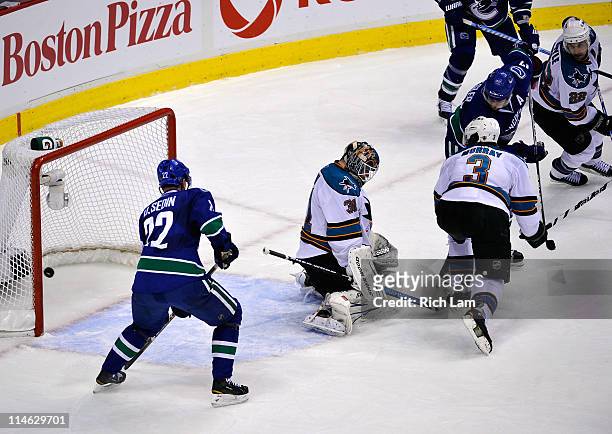 Ryan Kesler of the Vancouver Canucks deflects the puck into the net for a goal to tie the game at 2-2 with less than 14 seconds left in the third...