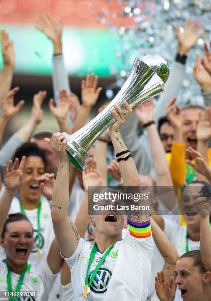 Nilla Fischer of Wolfsburg lifts the trophy after winning the Women's DFB Cup final match between VfL Wolfsburg and SC Freiburg at...