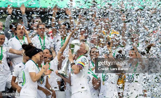 Nilla Fischer of Wolfsburg lifts the trophy after winning the Women's DFB Cup final match between VfL Wolfsburg and SC Freiburg at...