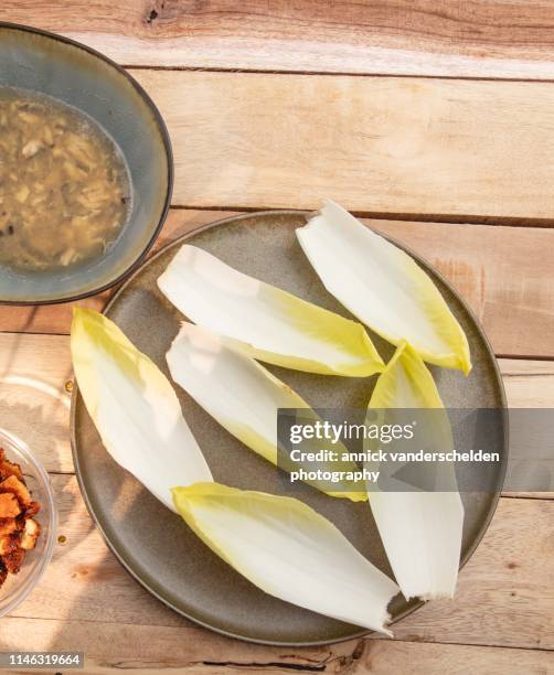 endive salad with anchovy dressing mise en place - endive stock pictures, royalty-free photos & images