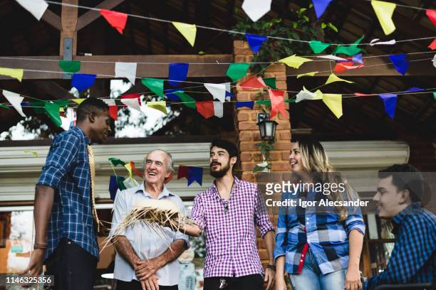 friends chatting during the brazilian junina party - 18 23 months stock pictures, royalty-free photos & images