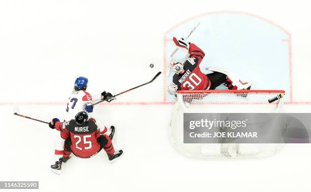 Canada's goalkeeper Matt Murray deflects the puck from Czech Republic's forward Michael Frolik during the semifinal match Canada vs Czech Republic of...