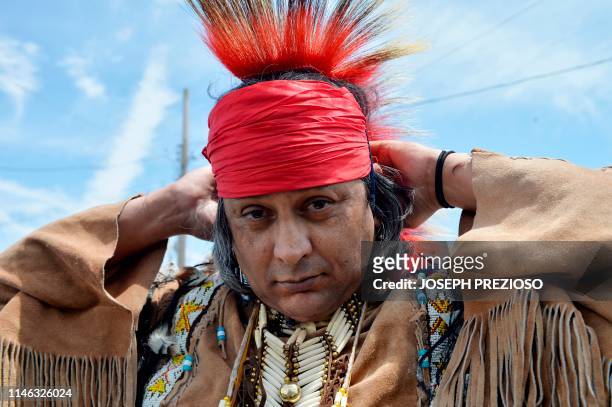 Egene, an Apache, gets ready in the parking lot at the 29th Annual Spring Planting Moon Pow Wow run by the Massachusetts Center for Native American...