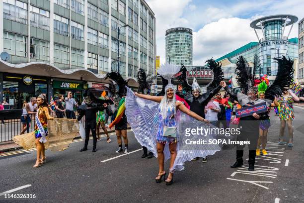 Members of the LGBTQ community are seen during the Birmingham Pride parade. Birmingham Pride this year is endorsing the controversial of No Outsiders...