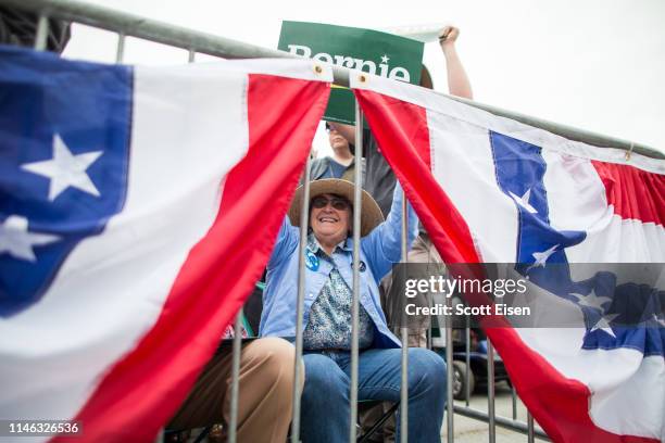 Supporter of Democratic presidential candidate Bernie Sanders holds up a campaign sign during a rally in the capital of his home state of Vermont on...