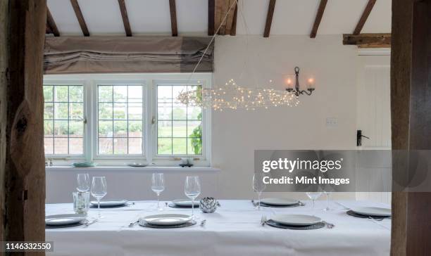 set table in dining room - rustic dining room stock pictures, royalty-free photos & images