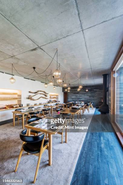 tables and chairs in modern cafe - vila real district portugal stockfoto's en -beelden