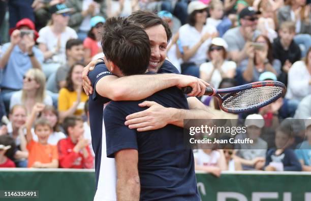 French singer Vianney Bureau and Fabrice Santoro celebrate the victory against Chinese actor Jin Dong and Zhang Shuai of China during the final of...