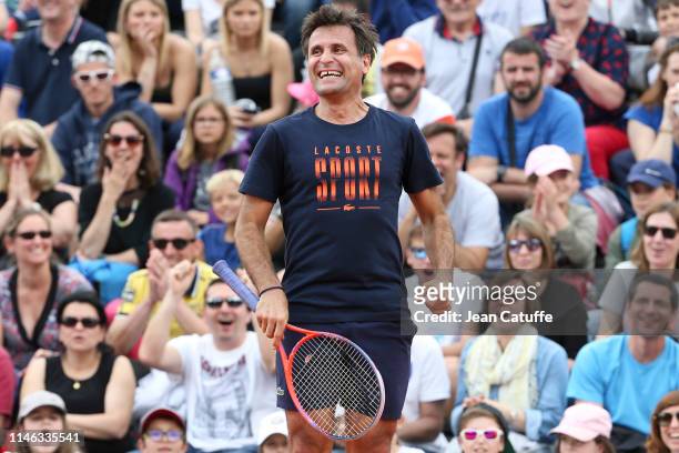 Fabrice Santoro - paired with French singer Vianney Bureau - in action against Chinese actor Jin Dong and Zhang Shuai of China during the final of...