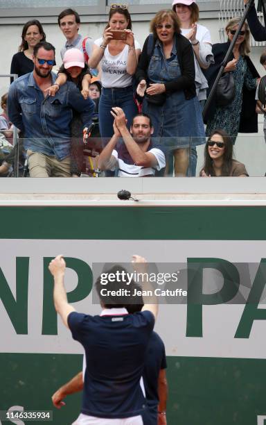 French swimmer Camille Lacourt applauds Vianney and Fabrice Santoro after they won the final of 'Stars, set and match', a mini celebrity tournament...