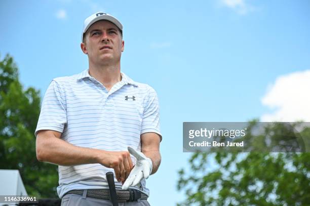 Jordan Spieth puts on his glove while standing on the fourteenth tee box during the third round of the Charles Schwab Challenge at Colonial Country...