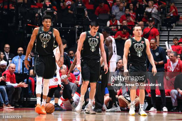 Giannis Antetokounmpo, Ersan Ilyasova, and Pat Connaughton of the Milwaukee Bucks look on during a game against the Toronto Raptors during Game Six...