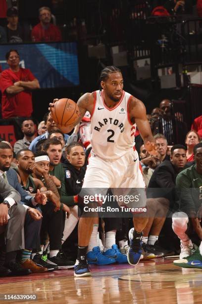 Kawhi Leonard of the Toronto Raptors handles the ball during the game against the Milwaukee Bucks during Game Six of the Eastern Conference Finals on...