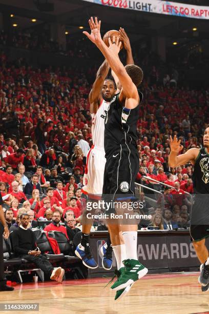 Kawhi Leonard of the Toronto Raptors shoots the ball during the game against Brook Lopez of the Milwaukee Bucks during Game Six of the Eastern...