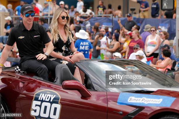 IndyCar driver Simon Pagenaud of the Menards Team Penske Chevrolet and his girlfriend Hailey McDermott during the 500 Festival Parade on May 25 in...