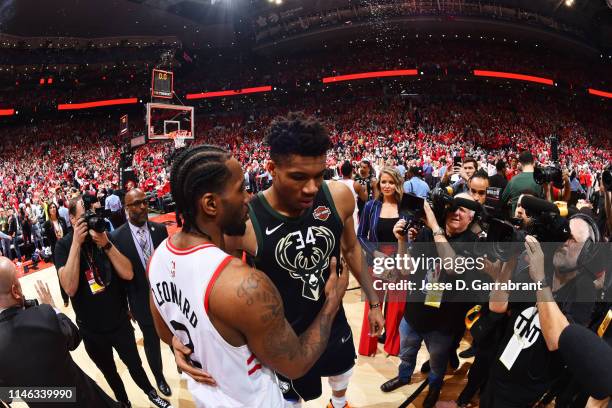 Kawhi Leonard of the Toronto Raptors and Giannis Antetokounmpo of the Milwaukee Bucks hug after Game Six of the Eastern Conference Finals on May 25,...