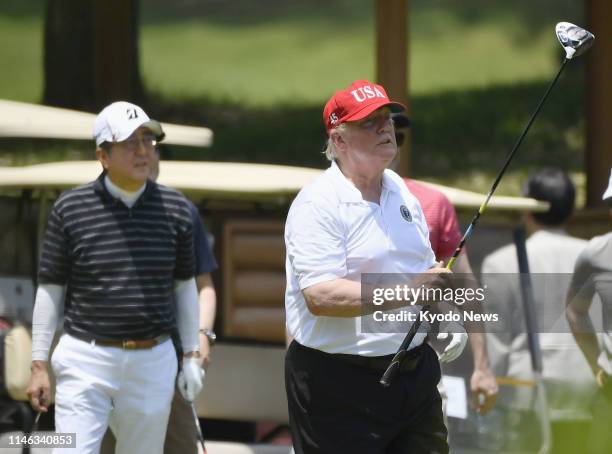 President Donald Trump and Japanese Prime Minister Shinzo Abe play golf at Mobara Country Club in Chiba Prefecture, near Tokyo, on May 26 their fifth...