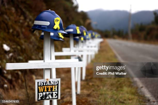 White crosses and saftey helmets are pictured on the access road to the Pike River Mine on May 02, 2019 in Greymouth, New Zealand. 29 men were...