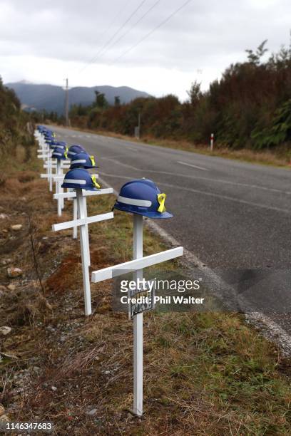 White crosses and saftey helmets are pictured on the access road to the Pike River Mine on May 02, 2019 in Greymouth, New Zealand. 29 men were...