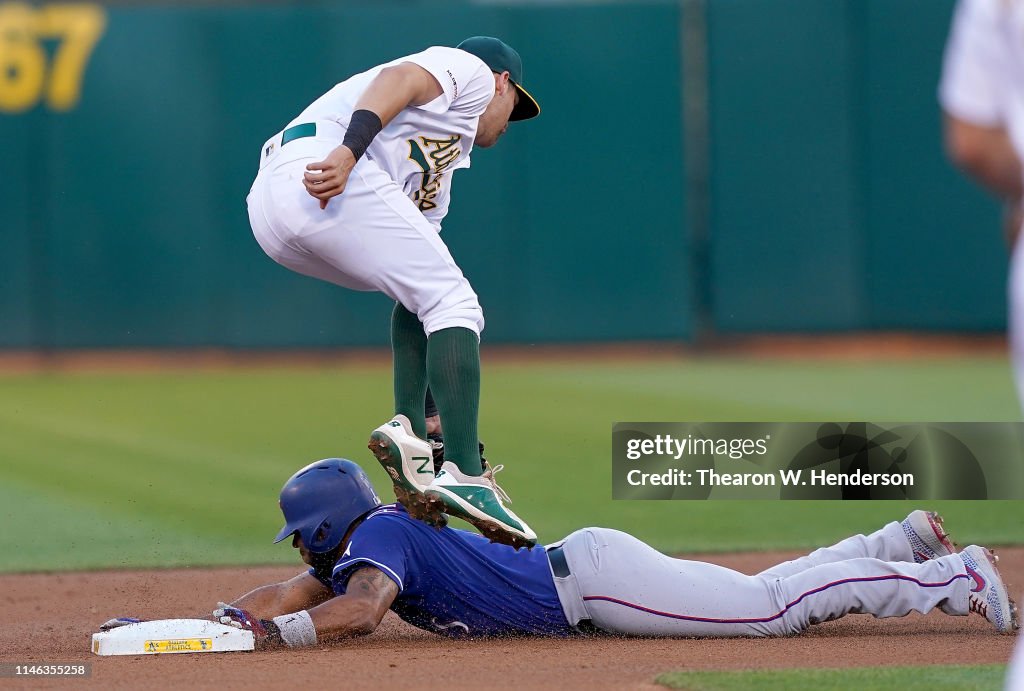 Texas Rangers Andrus Elvis Andrus of the Texas Rangers steals second base sliding under ...