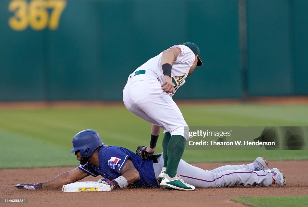Texas Rangers Andrus Elvis Andrus of the Texas Rangers steals second base sliding under ...