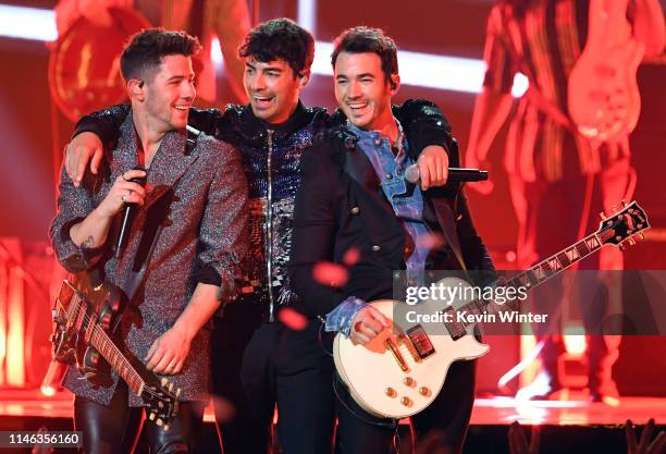Nick Jonas, Joe Jonas, and Kevin Jonas of Jonas Brothers perform onstage during the 2019 Billboard Music Awards at MGM Grand Garden Arena on May 01,...