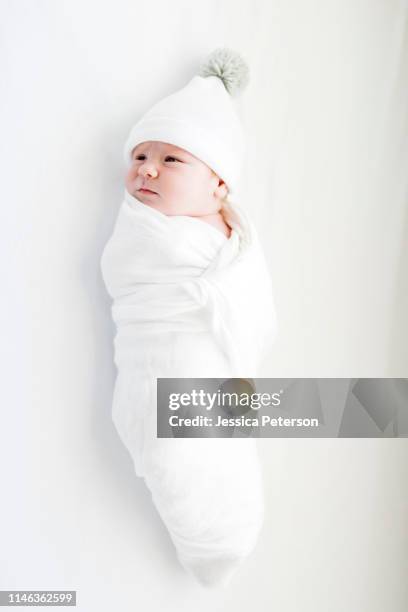 view directly above swaddled baby boy - baby blanket stock pictures, royalty-free photos & images