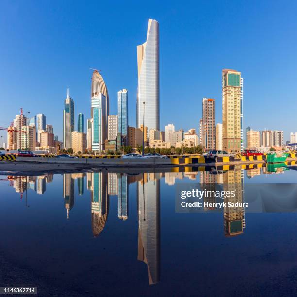 skyline reflected in sea in kuwait city, kuwait - kuwaiti stock pictures, royalty-free photos & images