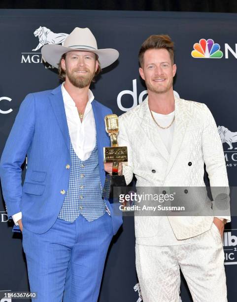 Brian Kelley and Tyler Hubbard of Florida Georgia Line pose with the award for Top Country Song for 'Meant to Be' in the press room during the 2019...