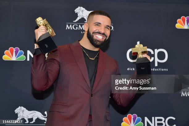 Drake poses with the awards for Top Artist, Top Male Artist, Top Billboard 200 Album for “Scorpion”, in the press room during the 2019 Billboard...