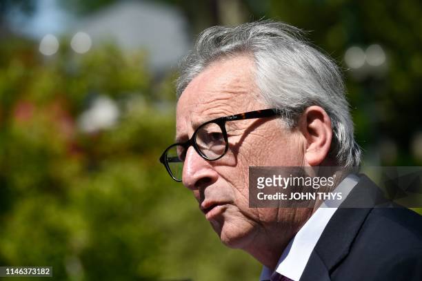 Jean-Claude Juncker, head of the European Commission speaks to the press outside a polling station in Capellen, on May 26 after a vote as part of the...