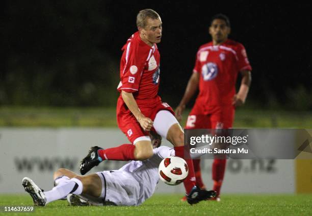 Martin Bullock of Waitakere competes for the ball with David Mulligan of the All Whites during the friendly match between the New Zealand All Whites...