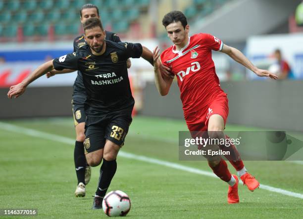 Khvicha Kvaratskhelia of FC Lokomotiv Moscow and Aleksandr Sukhov FC Ufa vie for the ball during the Russian Premier League match between FC...