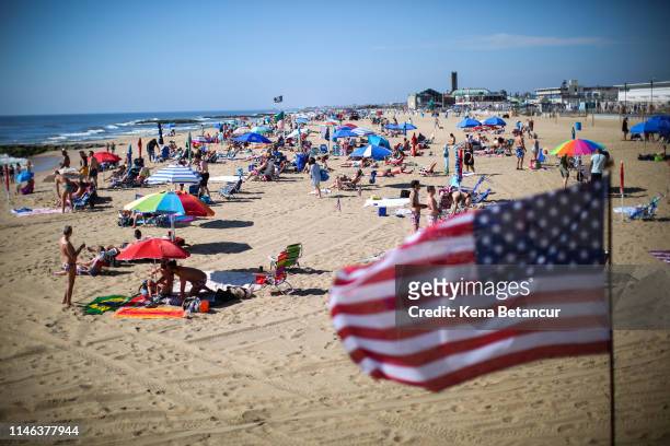 People visit the beach during Memorial Day weekend on May 26, 2019 in Asbury Park, New Jersey. Memorial Day is the unofficial start of summer and...