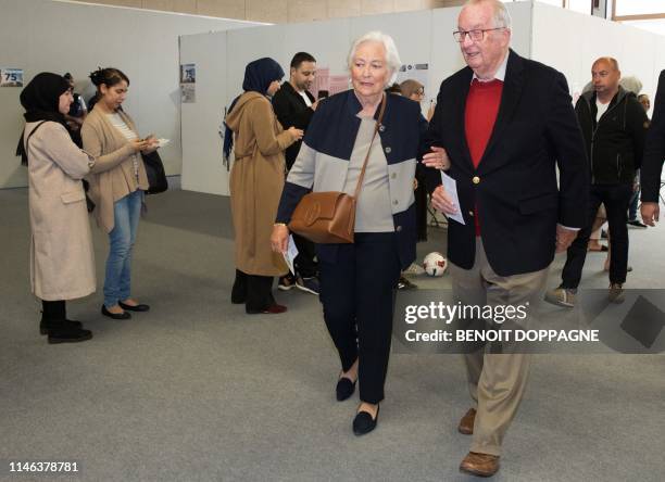 Queen Paola of Belgium and King Albert II of Belgium walk through a polling station in Laken, Brussels on May 26 as the country holds regional,...