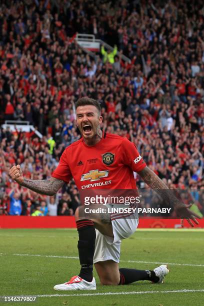 Manchester United '99 Legends player David Beckham celebrates after scoring their fifth goal during the Treble Reunion 20th anniversary football...