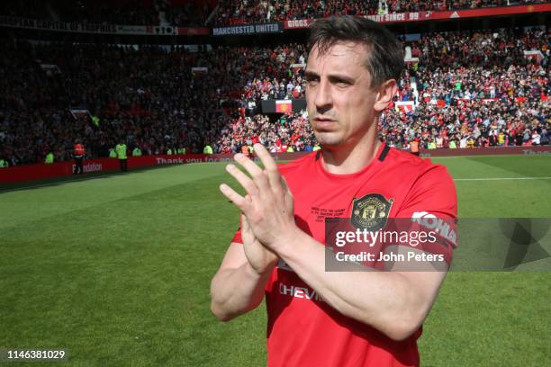 Gary Neville of Manchester United '99 Legends acknowledges the fans at the end of the 20 Years Treble Reunion match between Manchester United '99...