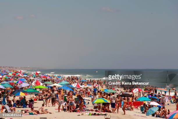 People take to the beach during Memorial Day weekend on May 26, 2019 in Seaside Heights, New Jersey. Memorial Day is the unofficial start of summer...