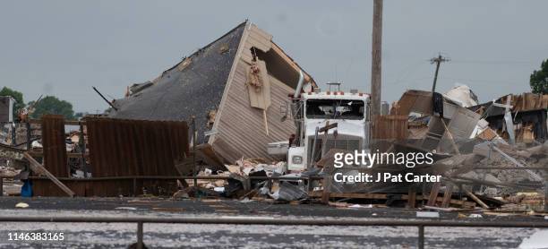 Semi truck sits among the rubble after a tornado struck the American Budget Value Inn May 26, 2019 in El Reno, Oklahoma. At least two people were...