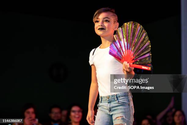 Child participates in a fashion show during RuPaul's DragCon LA 2019 at the Los Angeles Convention Center in Los Angeles, California. The annual...