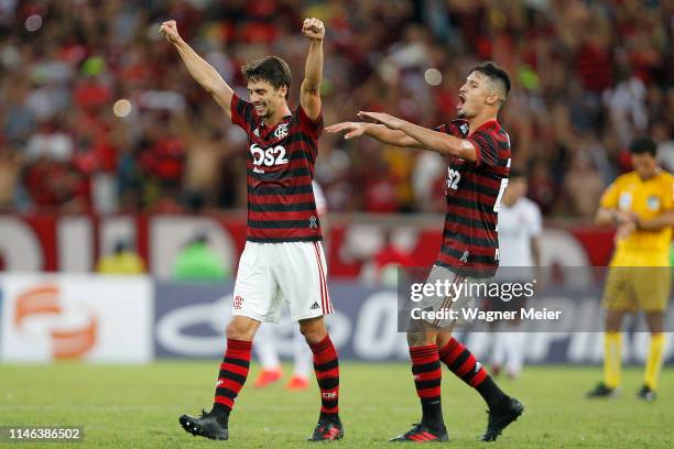 Rodrigo Caio of Flamengo celebrates with teammate Matheus Thuler after scoring the third goal of his team during a match between Flamengo and...