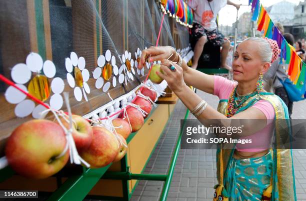 Hare Krishna devotee is seen decorating a chariot eight meters high during the Ratha-Yatra Carnival of Chariots in the Kiev. According to mythology,...