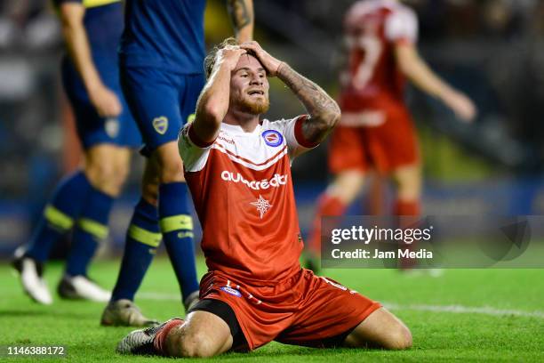 Alexis Mac Allister of Argentinos Juniors reacts after missing a goal during a during a second leg semifinal match between Boca Juniors and...