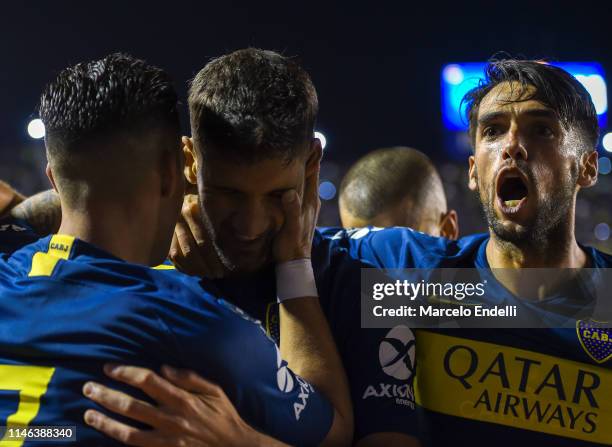 Lisandro Lopez of Boca Juniors celebrates with teammates after scoring the first goal of his team during a second leg semifinal match between Boca...