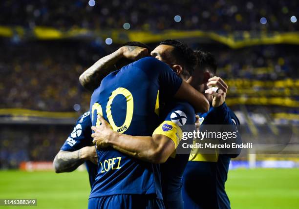 Lisandro Lopez of Boca Juniors celebrates with teammates after scoring the first goal of his team during a second leg semifinal match between Boca...