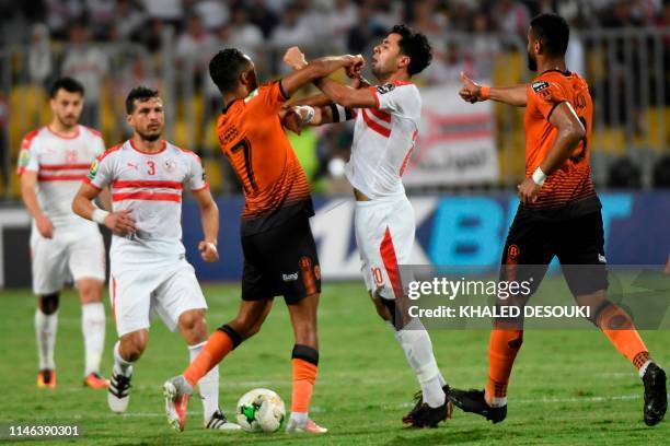 Egypt's Zamalek player Mohamed Ibrahim clashes with Morocco's RSB Berkane player amine el-Kess during the second leg of the CAF Confederation Cup...