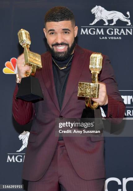 Drake poses with the awards for Top Artist, Top Male Artist, Top Billboard 200 Album for “Scorpion”, Top Billboard 200 Artist, Top Hot 100 Artist,...
