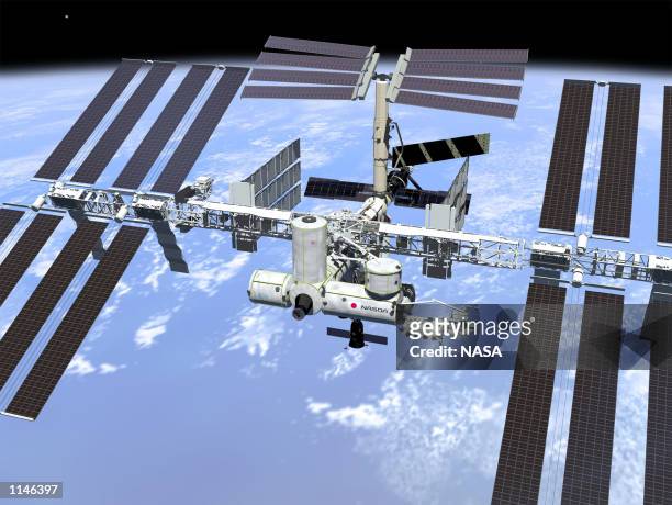 This artist's concept shows the International Space Station when its assembly sequence is completed in 2004, including minor changes to the final...