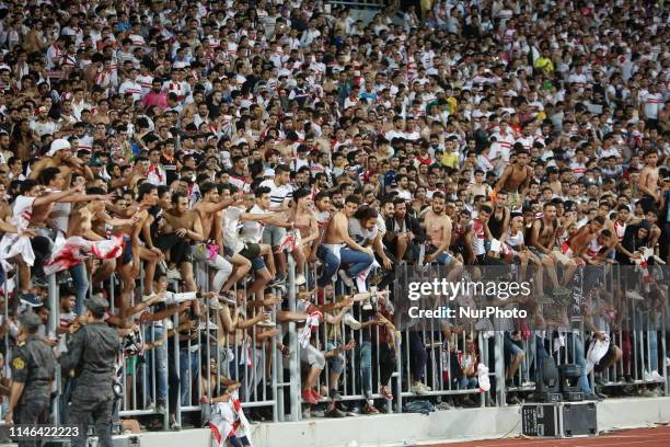 Egypt's Zamalek fans celebrate after they won the CAF Confederation Cup final football match between Egypt's Zamalek and Morocco's RSB Berkane at...